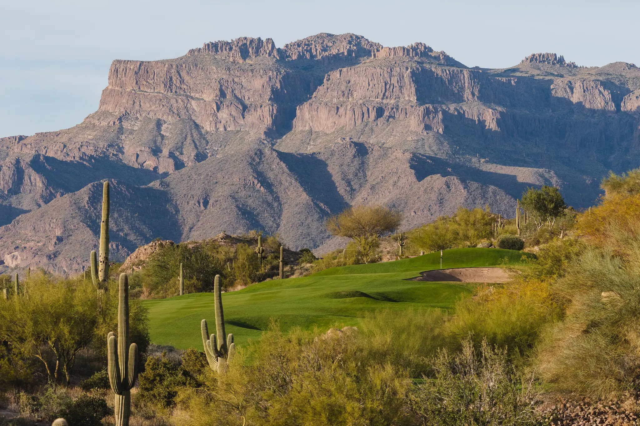 A view of the mountains from a golf course.