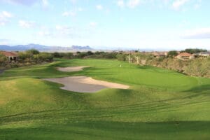 A view of a golf course with sand traps.